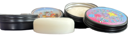 Sniper Sauce hockey stick wax side view including the tins with screw top lids.
